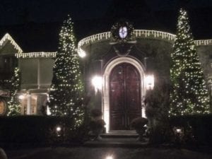 Christmas light on house with wooden door