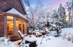 snow filled outside patio of a home